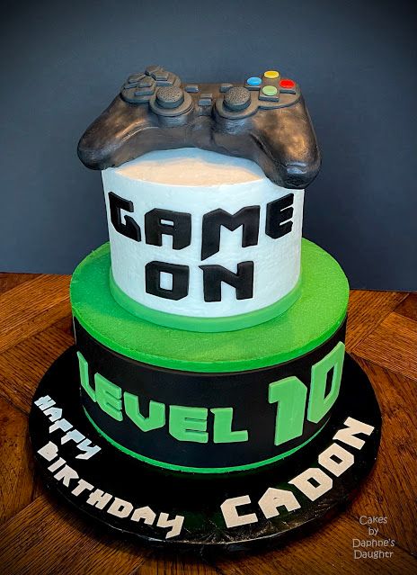 a birthday cake with a video game controller on top