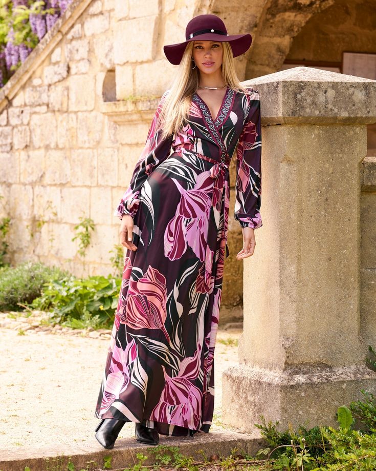 Our Olivia Fleurs Embellished Charmeuse Maxi Dress merges bold florals with boho vibes. It heroes oversized burgundy and pink florals that accentuate the luxurious wrap silhouette beautifully, finished with an embellished trim to create a captivating must-have. Glamorous Floral Print Maxi Dress, Glamorous Multicolor Floral Print Dress, Glamorous Multicolor Floral Dress, Pink Bohemian Floral Dress For Party, Pink Bohemian Party Dress, Bohemian Floral Print Dress For Party, Bohemian Evening Maxi Dress For Fall, Bohemian Maxi Dress With Surplice Neckline And Floral Print, Bohemian Dresses With Floral Print And Surplice Neckline