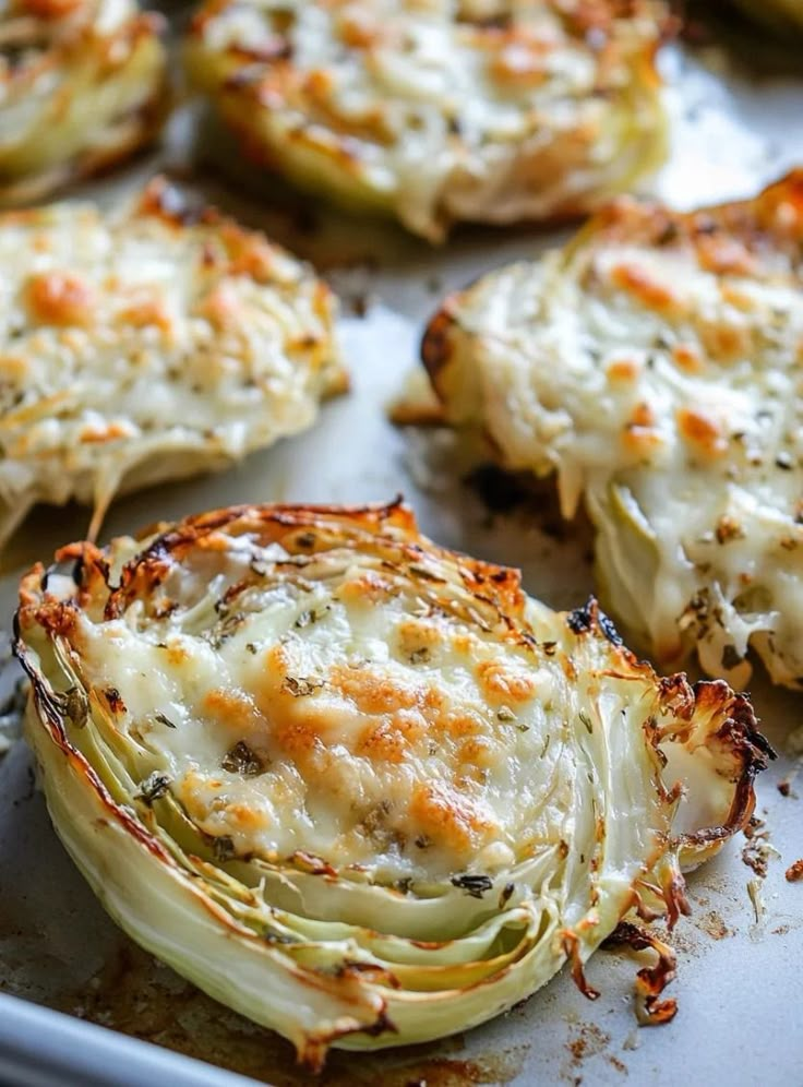 baked artichokes on a baking sheet ready to be eaten