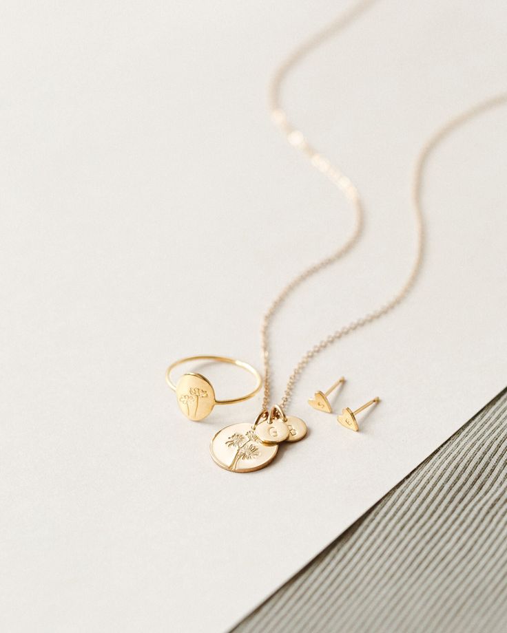 Flowers are our love language—which one speaks to you? Spotlight your favorite bloom with this floral spin on our best-selling Bennett Necklace! Make it extra meaningful with tiny add-on tags personalized with an initial or symbol. Another reason to love this piece: you can add extra initial tags as your story grows! Minimalist 14k Gold Filled Jewelry With Flower Charm, Minimalist Wedding Charm Necklace With Flower Charm, Minimalist Wedding Flower Charm Necklace, Minimalist 14k Gold Filled Birth Flower Jewelry, Everyday Jewelry With Flower Charm Round Pendant, Everyday Jewelry With Round Flower Charm Pendant, Sterling Silver Birth Flower Fine Jewelry, Everyday Rose Gold Flower Charm Jewelry, Recycled Gold Initial Pendant Charm Necklace As Gift