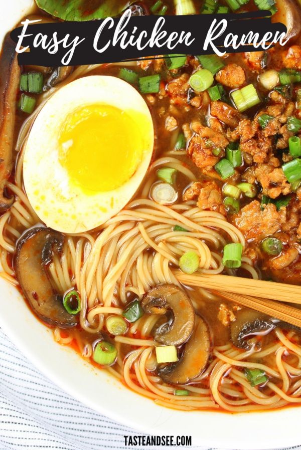 a bowl filled with noodles, meat and vegetables next to an egg on top of it