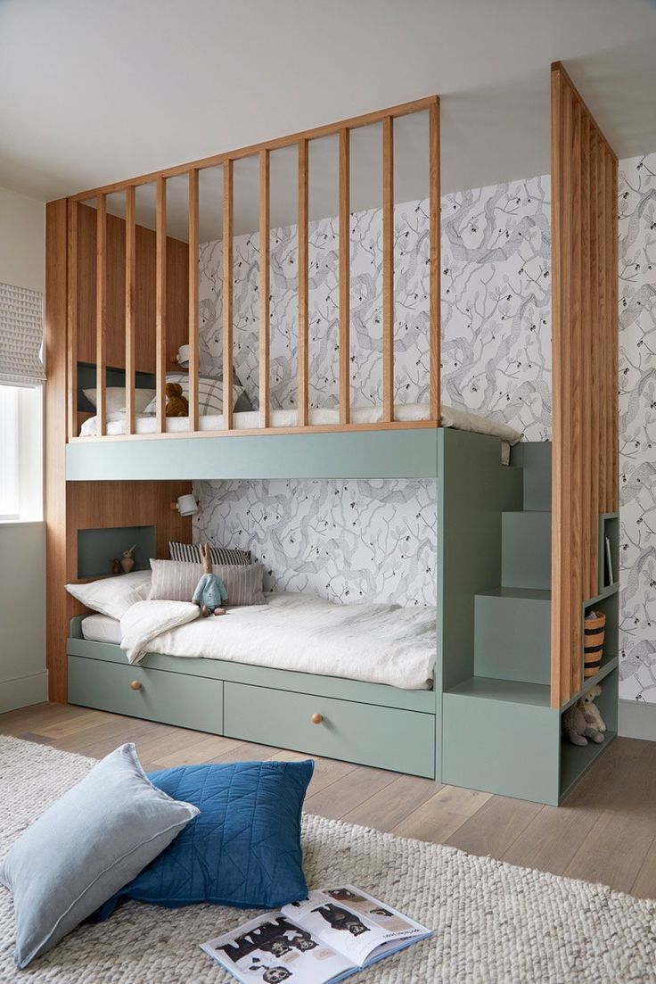 a bedroom with bunk beds and stairs in the wall, next to a rug on the floor