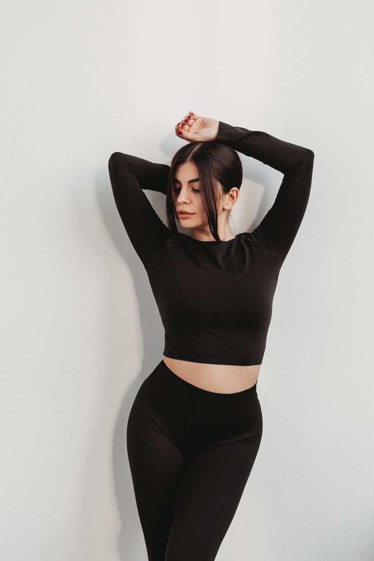 "Welcome to our Mandarinclothing shop, where style and performance unite seamlessly! 💫 Introducing our premium seamless microfiber crop top with long sleeves, the perfect fusion of athletic functionality and everyday chic. 🖤 Crafted from high-quality microfiber fabric, this crop top offers an ultra-comfortable second-skin fit that's ideal for your active lifestyle, whether you're hitting the gym, practicing yoga, or simply looking for a versatile and stylish wardrobe addition. Key Features: ✨ Seamless design for exceptional comfort and freedom of movement. 🏋️♀️ Ideal for sports, workouts, and all-day comfort. ️ Long sleeves for added coverage and style. 💧 Moisture-wicking technology keeps you fresh and dry. 🌱 Ethically produced with a focus on sustainability. Available in a range of c Seamless Micro-elastic Versatile Top, Versatile Micro-elastic Seamless Top, Seamless Long Sleeve Sports Top, Black Long Sleeve Elastane Crop Top, Sporty Seamless Long Sleeve Activewear, Seamless Long Sleeve Athleisure Tops, Black Seamless Long Sleeve Activewear, Seamless Long Sleeve Workout Tops, Black Long Sleeve Crop Top For Sports