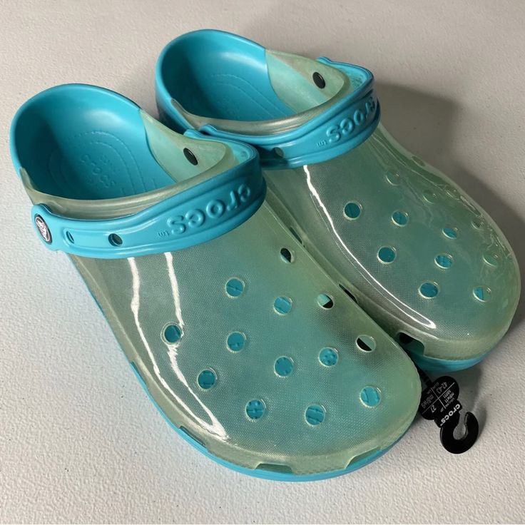 Crocs Unisex Classic Translucent Clog W7/M5 Digital Aqua 206908-4sl Blue Non-slip Casual Jelly Sandals, Spring Clogs With Translucent Outsole And Round Toe, Blue Casual Non-slip Jelly Sandals, Casual Blue Non-slip Jelly Sandals, Blue Waterproof Sandals With Round Toe, Waterproof Blue Sandals With Round Toe, Blue Waterproof Round Toe Sandals, Casual Clear Slip-on Jelly Sandals, Blue Closed Toe Jelly Sandals