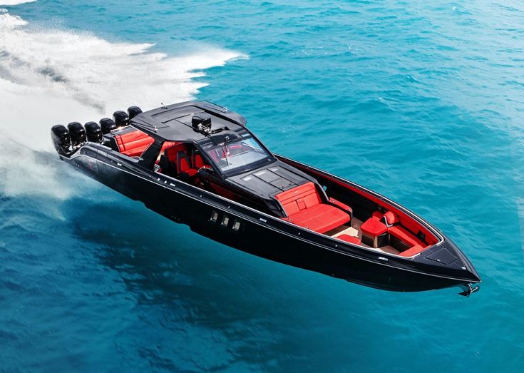 a black and red speed boat in the water