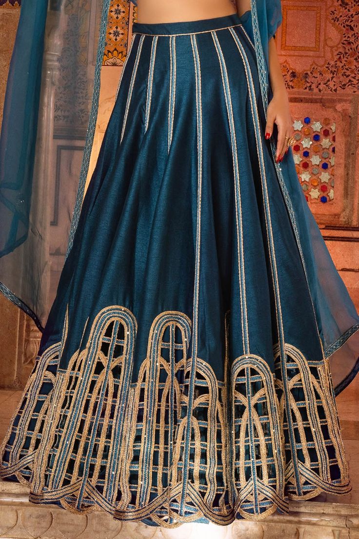 Teal blue lehenga with cording and sequin work. Comes with blouse and dupatta.
Component: 3
Pattern: Embroidery
Type Of Work: Cord and Sequin
Neckline: V neck
Sleeve Type: Sleeveless
Fabric: Raw Silk and Pure Organza
Color: Blue
Other Details: 
Dupatta with border
Plunging neckline
Occasion: Wedding - Aza Fashions Traditional Blue Gown With Pallu, Blue Embroidered Gown For Diwali, Blue Anarkali Set With Intricate Embroidery For Reception, Blue Floor-length Salwar Kameez With Intricate Embroidery, Blue Saree Gown With Intricate Embroidery, Blue Semi-stitched Gown With Intricate Embroidery, Traditional Blue Gown With Traditional Drape, Traditional Blue Gown With Drape, Blue Gown With Intricate Embroidery Semi-stitched