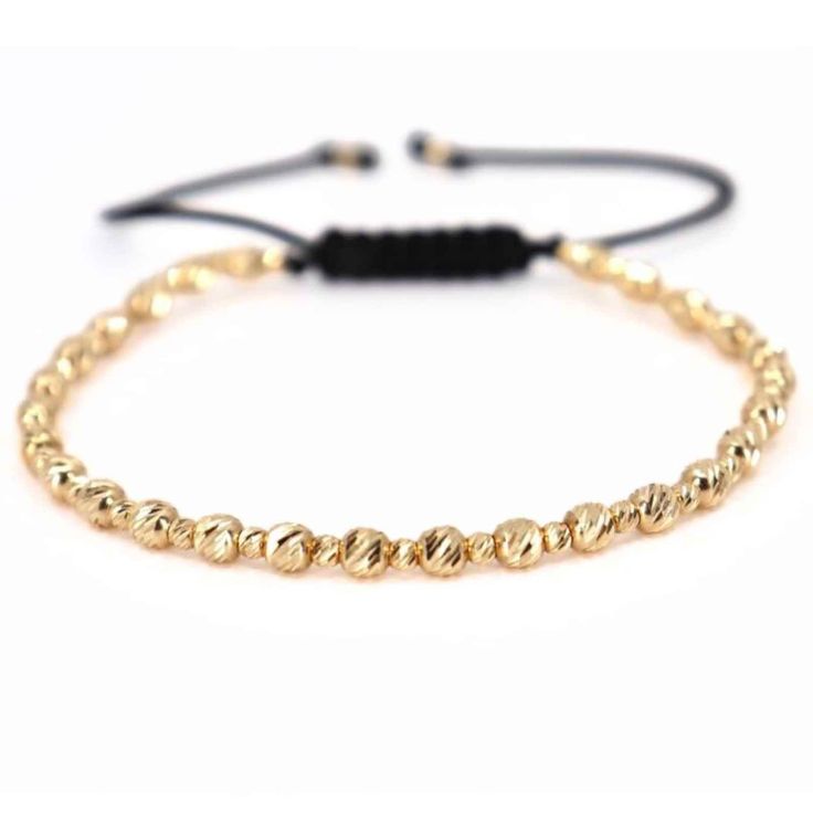 14K Solid Gold Bead Bracelet, Gold Ball Bracelet, Diamond Cut Bracelet, Gold Italian Bracelet, Real Gold Bracelet, Perfect Gift for Him ✨Expertly handmade, this elegant bracelet showcases a total of 57 finely crafted beads in 14K gold, featuring 30 beads at 2.5 mm and 27 beads at 4 mm, arranged in an alternating pattern, all on a highly flexible adjustable cord. The total gold weight is 3.87 grams. The intricate arrangement of varying bead sizes adds a textured and refined look, enhancing the br Elegant Gold Friendship Bracelets With Gold Beads, Elegant Gold Hand-strung Friendship Bracelets, Adjustable Gold Braided Bracelet With Round Beads, Adjustable Yellow Gold Hand-strung Bracelet, Adjustable Yellow Gold Pearl Bracelet With Round Beads, Adjustable Gold Pearl Jubilee Bracelet, Elegant Adjustable Rosary Bracelet With 8mm Beads, Adjustable Yellow Gold Rosary Bracelet, Adjustable Gold Friendship Bracelets With Spacer Beads