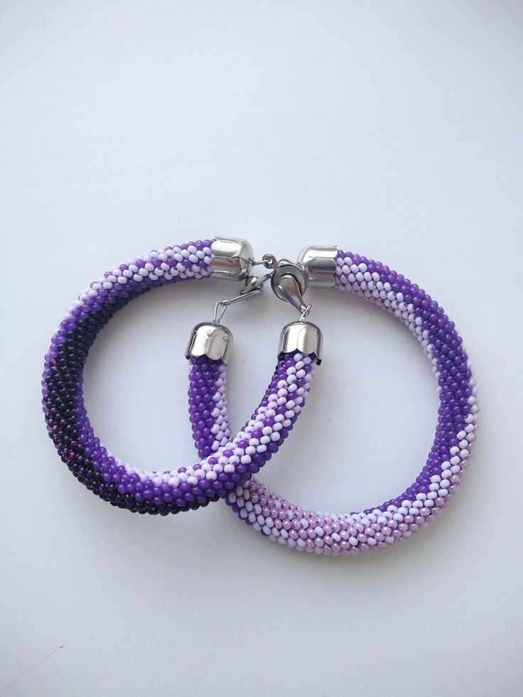 Bright purple bracelets, but with the same pattern Lavender Bracelets With Tiny Beads For Gift, Lavender Beaded Bracelet With Tiny Beads For Gifts, Purple Tiny Beads Beaded Bracelets As Gift, Bohemian Lavender Beaded Bracelets, Lavender Beaded Bracelets With Tiny Round Beads, Lavender Beaded Bohemian Bracelets, Purple Tiny Beads Friendship Bracelet As Gift, Purple Friendship Bracelet With Tiny Beads As Gift, Lavender Bracelets With Colorful Beads