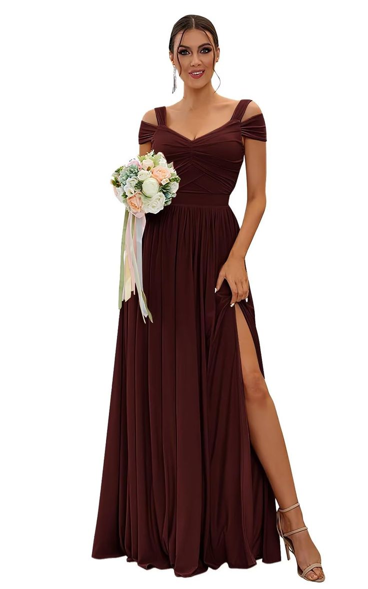 a woman wearing a long dress with thigh high slits and a flower in her hand