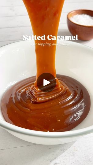 caramel sauce being poured into a white bowl