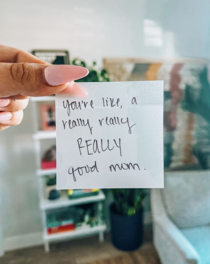 a person holding up a piece of paper that says you're like, a rainy rainy rally really good mom