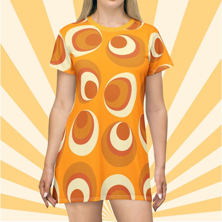 Mini dress groovy gift for her funky circle print with mod mustard color gift idea hippie T shirt party dress for summer gift idea for her. Looking for that dress that makes you stand out in a crowd, then this cute retro mini dress is for you! Show them your flair for fun and look good doing it in this fun, mod, 60's inspired Boho dress!! Be sure to check out all the fun styles available. https://www.etsy.com/shop/LuluandSamCo This All-Over-Print T-Shirt Dress is tagless, custom cut and sewn to Retro Printed Mini Dress For Summer, Trendy Retro Print Spring Dresses, Trendy Spring Dresses With Retro Print, Orange Retro Print Summer Dress, Casual Short Sleeve Dress With Retro Print, Casual Short Sleeve Retro Print Dress, Summer Retro Print Mini Dress, Retro Printed Summer Dress, Summer Mini Dress With Retro Print