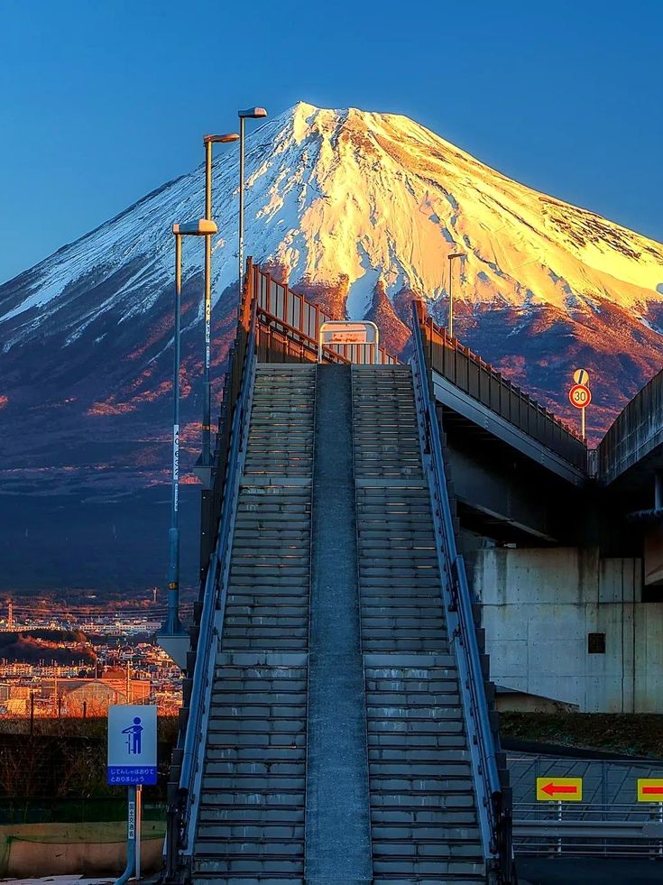 an escalator leading to the top of a mountain