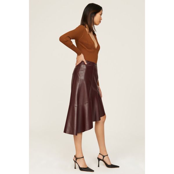 Brown faux leather (100% Polyurethane). Lining (100% Polyester). A-line. Side zipper closure. 28.5" from waist to hemline. Imported. Fall Office Flared Skirt Bottoms, Fall Office Wear Flared Skirt, Flared Skirt For Office In Fall, Modern Asymmetrical Skirt For Fall, Sleek Lined Skirt For Fall, Sleek Fall Skirt, Faux Leather Skirt For Formal Fall Events, Chic Office Skirt With Zipper Closure, Fall Asymmetrical Skirt For Night Out