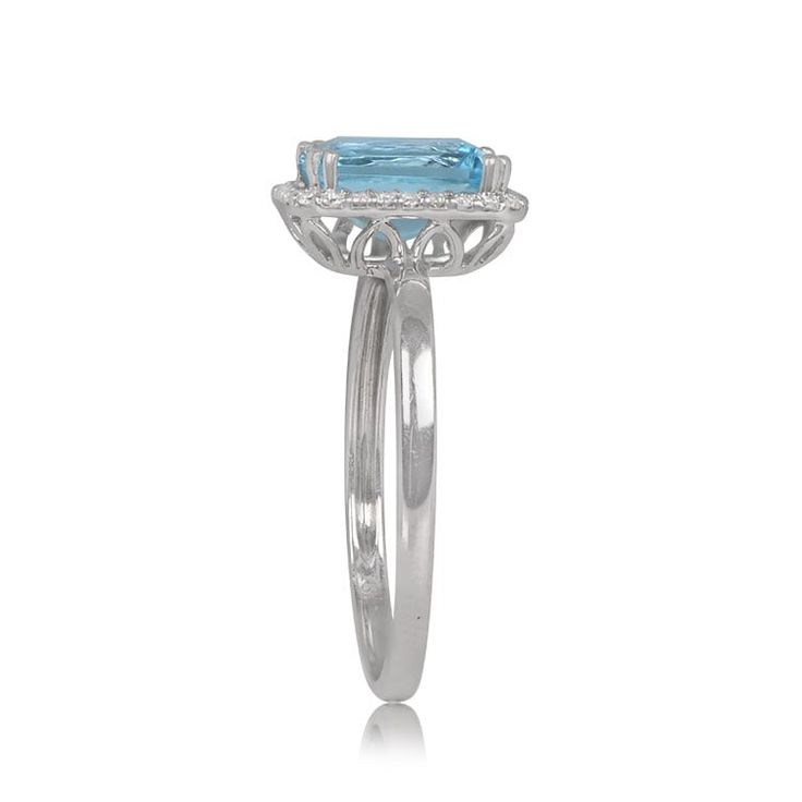 A December birthstone ring that centers a lively blue topaz weighing approximately 1.70 carats with a London blue saturation. Surrounding the center gemstone is a row of white diamonds with a total approximate weight of 0.13 carats. This 18k white gold ring features a detailed under-gallery.
The measurements of the center gemstone is 8.00mm x 6.00mm x 4.30mm. The measurements of this ring with the halo of diamonds is 10.50mm x 8.95mm.
This ring has a low profile and sits 5.45mm above the finger.
If you have any questions about our Monroe December Birthstone Ring, please feel free to contact us. Light Blue Diamond Rings With Prong Setting, Luxury Blue Topaz Halo Ring, Diamond Halo Topaz Ring For Promise, Baguette Cut Topaz Ring With Diamond Halo, Baguette Cut Topaz Ring With Diamond Halo Setting, Diamond Topaz Ring With Halo Design For Promise, Blue Topaz Ring With Halo Design, Fine Jewelry Blue Topaz Halo Ring, Blue Topaz Ring With Halo Setting