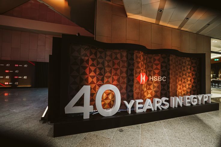 a sign that says 40 years in egypt on the front of a building at night