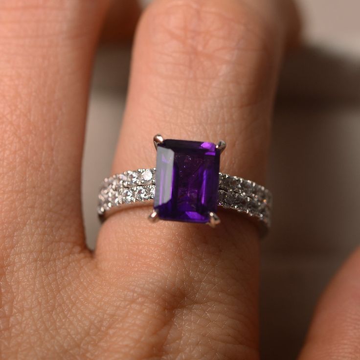 This ring features a 7*9mm natural amethyst and sterling silver finished with rhodium. Customization is available. It is made by hand, and it will take about 7 days to finish the ring after your payment is completed. Main stone: natural amethyst Amethyst weight: Approx 2.30 ct Metal type: sterling silver finished with rhodium Accent stone: cz Customization is available, I also can make it with 14k solid gold (white or yellow or rose) and diamond accent stone, just feel free to contact me. Any qu Luo Jewelry, Emerald Cut Halo Ring, Emerald Cut Wedding Band, Amethyst Wedding Rings, Amethyst Ring Vintage, Amethyst Engagement Ring, Micro Pave Ring, Amethyst Ring Engagement, Pave Diamond Ring