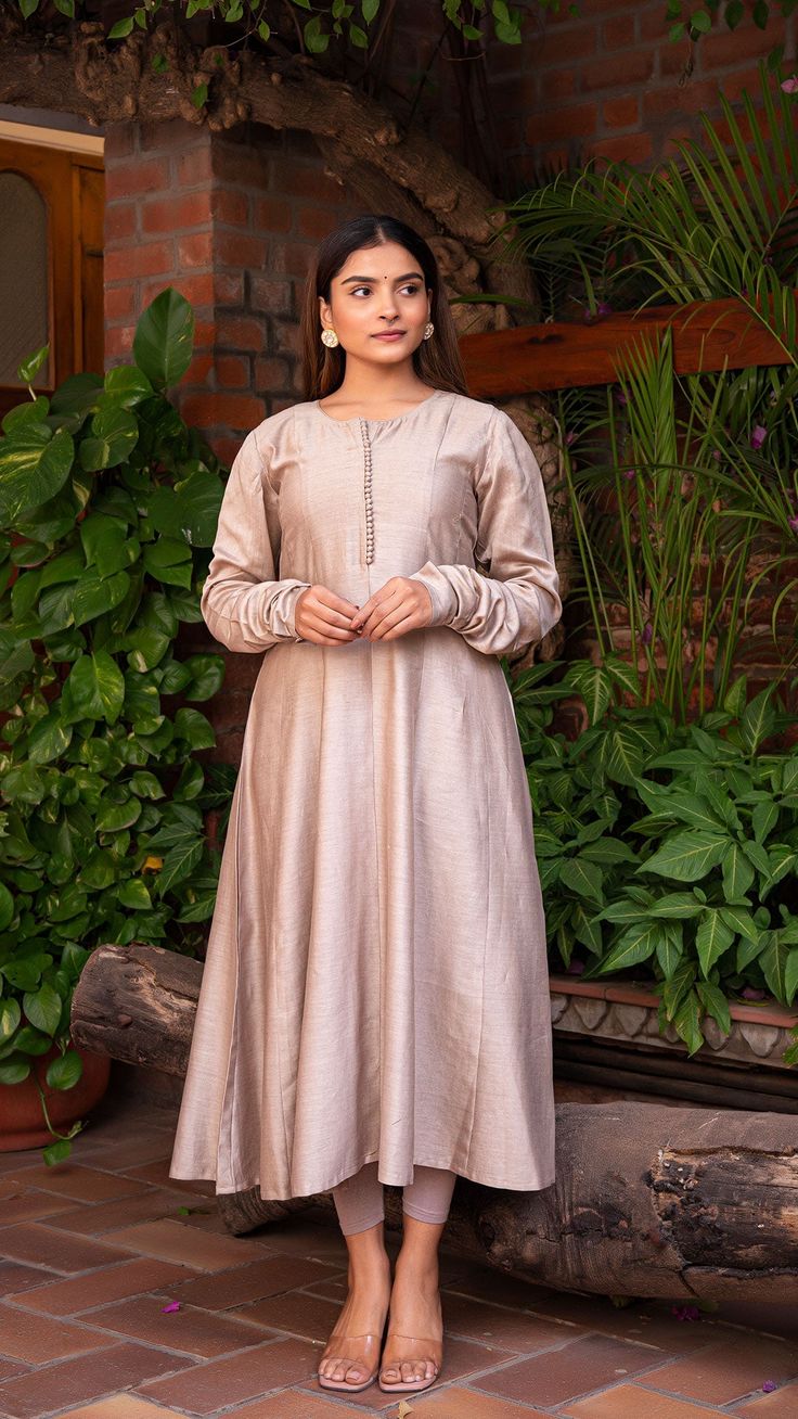 Wedding Tussar Silk Churidar, Designer Tussar Silk Straight Kurta Dress, Anarkali Tussar Silk Kurta With Dabka Work, Cotton Silk Floor-length Anarkali Set, Long Sleeve Slub Silk Dress With Zari Work, Designer Slub Silk Dress For Diwali, Silk Churidar For Navratri, Long Sleeve Dress In Slub Silk With Zari Work, Bollywood Style Long Sleeve Slub Silk Dress