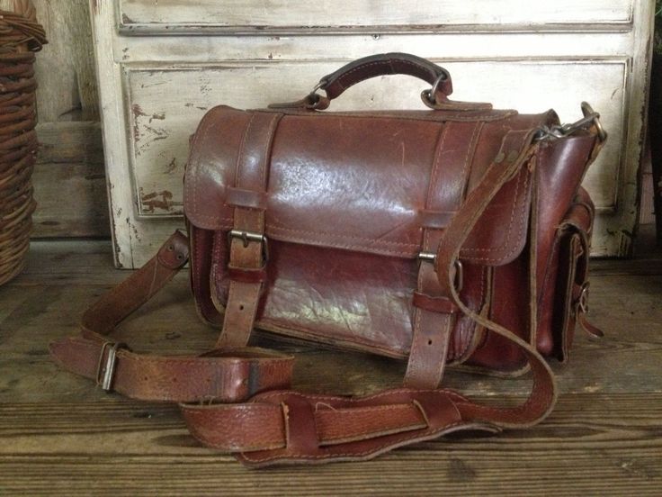 "Vintage Artisan Rustic Brown Leather Handbag Mini Briefcase ~~ c 1970s 2 side pockets with strap & buckle closures, 2 front strap and buckle closures. One pocket under the front flap. Silver hardware. Top leather carry handle that is studded in place. Adjustable and removable extra long carry strap to wear as a crossbody bag. Shoulder guard. Measures 12\" length, 14\" length including pockets, approx. 8\" height, approx. 6\" - 7\" depth including front pocket. Please check all measurements Retro Saddle Shoulder Bag With Detachable Strap, Retro Business Satchel With Detachable Strap, Classic Flap Bag With Buckle Closure, Classic School Saddle Bag With Adjustable Strap, Retro Travel Bag With Hasp Closure, Travel Satchel Briefcase With Hasp Closure, Retro Shoulder Bag With Hasp Closure For Travel, Travel Briefcase Satchel With Hasp Closure, Travel Satchel Saddle Bag With Buckle Closure