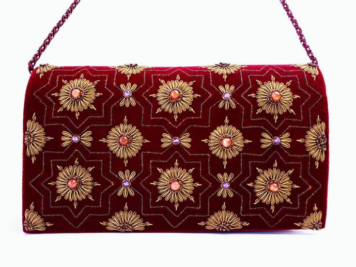 "Burgundy velvet clutch bag, zardozi evening bag, embroidered with copper medallions and embellished with genuine semi precious stones, to give an opulent, multidimensional dazzling effect. This is a gorgeous wardrobe investment piece! A classic design that will never go out of style! A modern heirloom to be cherished! Add instant glamour and elegance to any ensemble! Perfect for any evening occasion, be it wedding, gala, cocktail party. The word Zardozi means \"gold thread\". It is an elaborate Festive Gold Embroidered Evening Bag, Traditional Embroidered Velvet Clutch, Luxury Hand Embellished Evening Bag For Festive Occasions, Luxury Gold Embroidered Potli Bag For Festive Occasion, Formal Hand-embellished Potli Bag, Gold Evening Bag With Mirror Work, Luxury Zari Work Clutch For Festivals, Traditional Velvet Evening Bag, Elegant Bag With Mirror Work For Diwali