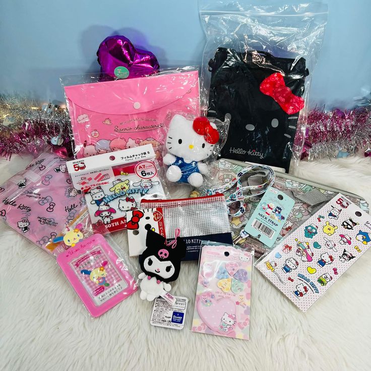 hello kitty items are laying out on the floor