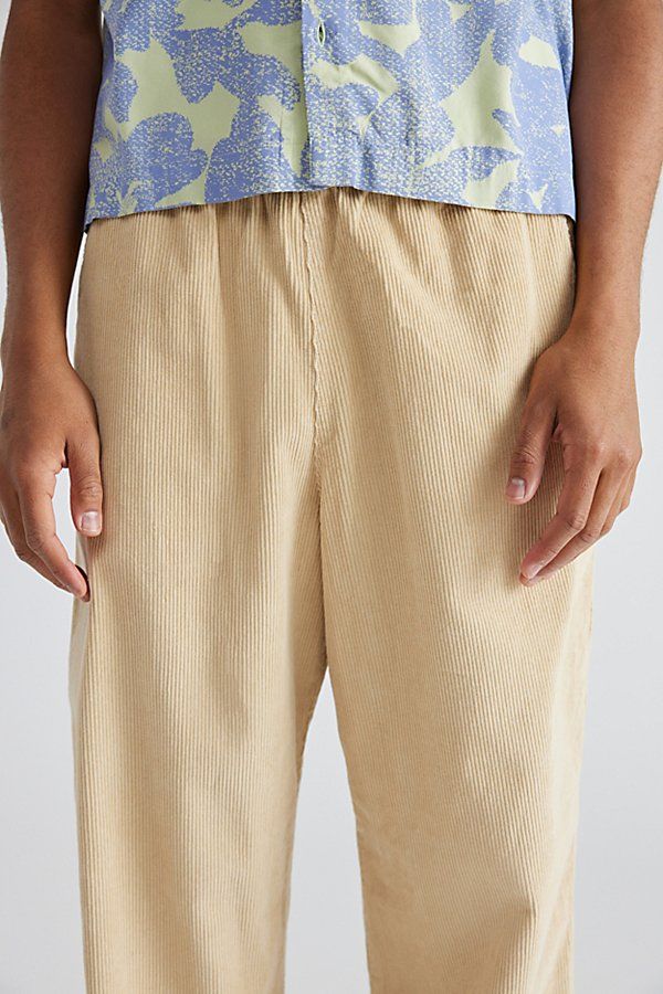 Baggy fit corduroy beach pants by Urban Outfitters featuring a stretch elastic waistband. Easy wear pants with a straight leg style in a relaxed silhouette. Features UO baggy solid cord beach pants Easy wear corduroy pants Stretch elastic waistband Textured cotton cord Relaxed fit Full length UO exclusive Content + Care 100% Cotton Machine wash Imported Size + Fit Model in Black is 6’1" and wearing size Medium Measurements taken from size Medium Rise: 12" Inseam: 30" Leg opening: 11" | Urban Out Relaxed Fit Corduroy Bottoms With Elastic Waistband, Casual Pants With Elastic Waistband By Urban Outfitters, Casual Urban Outfitters Pants With Elastic Waistband, Urban Outfitters Cotton Bottoms With Elastic Waistband, Urban Outfitters Relaxed Fit Beach Bottoms, Urban Outfitters Relaxed Beach Bottoms, Casual Corduroy Pants With Elastic Waistband, Urban Outfitters Relaxed Fit Cotton Bottoms, Urban Outfitters Cotton Relaxed Fit Bottoms