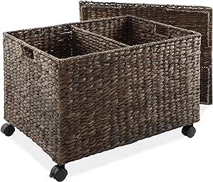 two brown baskets sitting on top of each other with black casteors and wheels in front of them