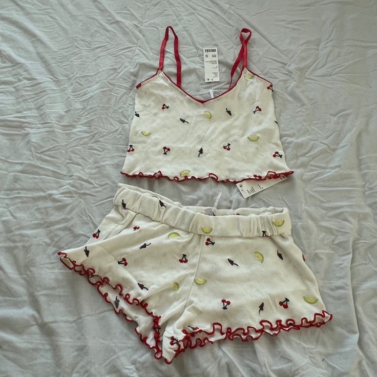 Urban Outfitters Primrose Pointelle Cami & Micro Short Set Size Small Condition: Nwt Color: White Details : - Delicate Lounge Set By Out From Under Crafted From A Pointelle Fabric. - Cami Is Ultra-Cropped With A Slim-Fit. - The Micro Mini Shorts Are Super Short And Cut With A Low-Rise Silhouette. - Finished With Lettuce Edging Throughout. - Matching Pointelle Top And Micro Short Set - Cropped Cami Top - Low-Rise Shorts Micro Shorts - Matching Set - Perfect For Lounging Or Pjs - Mix And Match Ext Pajama Set Tank Top And Shorts, For Love And Lemons Pajamas, Cute Fitted White Sleepwear, Fitted Summer Sleepwear, Fitted Short Sleepwear For Summer, Cute Fitted Summer Sleepwear, Sleep Sets Women, Cute Nightwear, Short Pjs