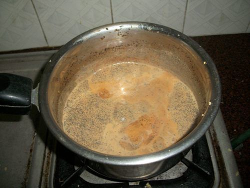 a pot on top of a stove filled with liquid