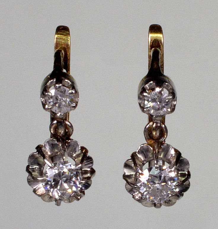 A splendid pair of French 18K gold platinum diamond earrings from Edwardian period C.1900. The earrings measure 12 mm high 6 mm wide. The diamonds are old European cut. The bottom ones measure 3.5 mm diameter or 0.15 Ct. The top diamonds are 2.5 mm or 0.15 Ct. The diamonds are set in platinum. The back of the earrings and the lever back clasps are 18K gold. The earrings are hallmarked with eagle - the French stamp for 18K gold. Platinum acid tested. Total weight is 2.9 grams. Excellent antique c Classic Hallmarked Yellow Gold Diamond Earrings, Classic Hallmarked Diamond Earrings, Classic Diamond Drop Earrings With 17 Jewels, Classic Formal Earrings With Rose Cut Diamonds, Antique Yellow Gold Diamond Earrings, Classic Hallmarked Diamond Earrings For Formal Occasions, Classic Hallmarked Diamond Earrings For Formal Events, Vintage Platinum Earrings, Platinum Earrings With Single Cut Diamonds For Wedding