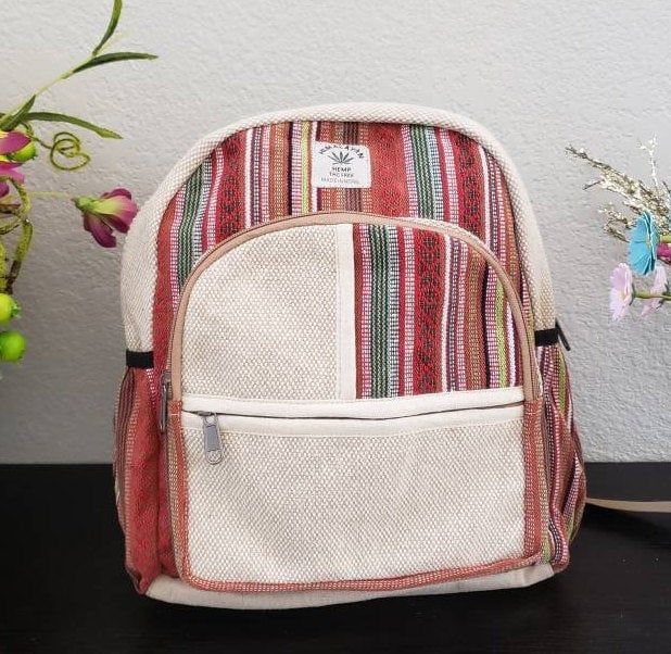 "Namaste Fashionable Unisex Multicolor Natural Hemp Handmade Organic Vegan Eco-Friendly Backpack. Hemp fabric is made by hand on a loom, it is completely handmade backpack and is made in Nepal with love and care. The bag features 1 large main zipped compartment, 2 front zipped compartment and 2 side pockets. No child labor is used and is fairly traded. No harmful chemicals has been used. Each print in the backpack represents rich art in Nepal, the print looks unique and special and the color rep Handmade Multicolor Backpack For School, Handmade Multicolor School Backpack, Casual Handmade Rectangular Backpack, Multicolor Cotton Backpack For Daily Use, Handmade Multicolor Casual Backpack, Casual Handmade Multicolor Backpack, Eco-friendly Multicolor School Backpack, Casual Multicolor Handmade Backpack, Eco-friendly Handmade Rectangular Backpack