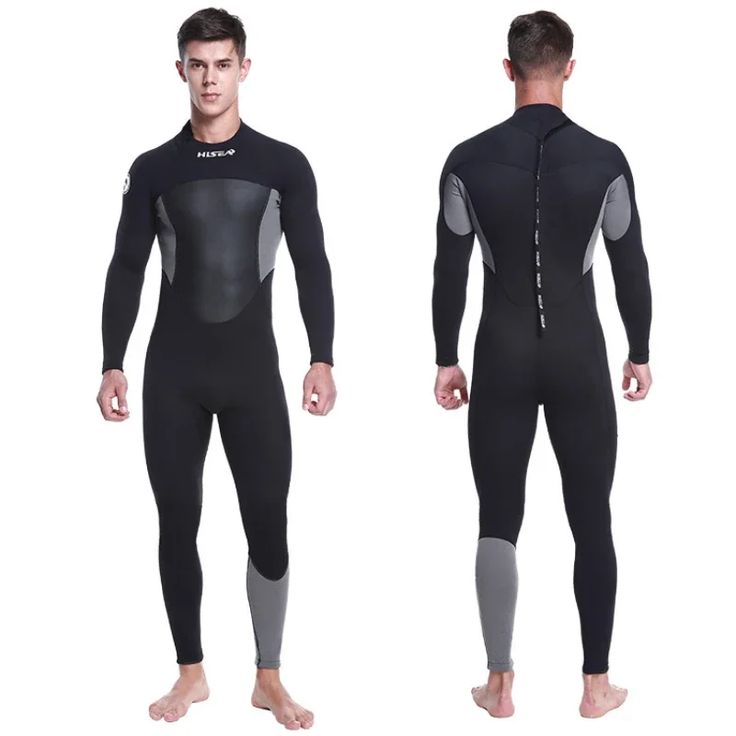 two men in wetsuits standing side by side, one wearing a full body suit