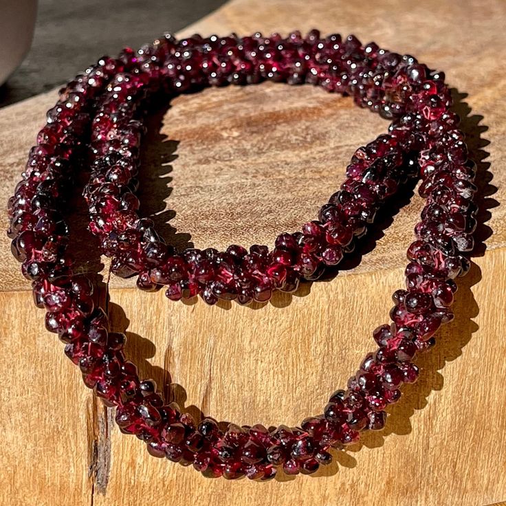 Red Garnet Endless Necklace . Approximately 25-26 inches . NO CLASP SLIP ON STYLE .                                                                             📌 Science & Origin : This Beautiful crystal was hand picked to show unique patterns. Beautifully shaped to facilitate meditation. These beautiful GARNET would be the perfect addition to anyone's home decor, crystal grid, or crystal collection!   📌 You will receive : 1 Pictured Crystal  *You will get the same one that is in the picture. Handmade Garnet Bead Necklaces, Handmade Garnet Beaded Necklaces, Handmade Garnet Necklaces With Round Beads, Red Garnet Beaded Necklaces With Round Beads, Red Garnet Round Bead Necklaces, Red Garnet Beaded Necklaces, Red Ruby Beads For Gifts, Handmade Burgundy Necklaces With Round Beads, Red Garnet Gemstone Beaded Necklaces