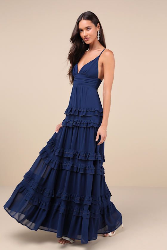 Simple yet stunning, there are so many elements of the Lulus Lavish Perfection Navy Blue Ruffled Tiered Maxi Dress that you'll love! This lovely dress is composed of lightweight woven chiffon that shapes a lightly gathered bodice, a flirty V-neckline, and adjustable spaghetti straps. The high, pleated banded waist tops an elegant A-line maxi skirt adorned with tiers of ruffled detailing throughout for an ultra-femme finish. Hidden back zipper/clasp. Fit: This garment fits true to size. Length: F Navy Blue Boho Dress, Fall Formal Dresses, Blue Bell Sleeve Dress, Blue Wedding Guest Dresses, Navy Blue Gown, Navy Blue Maxi Dress, Blue Dress Formal, Tiered Ruffle Dress, Blue Gown