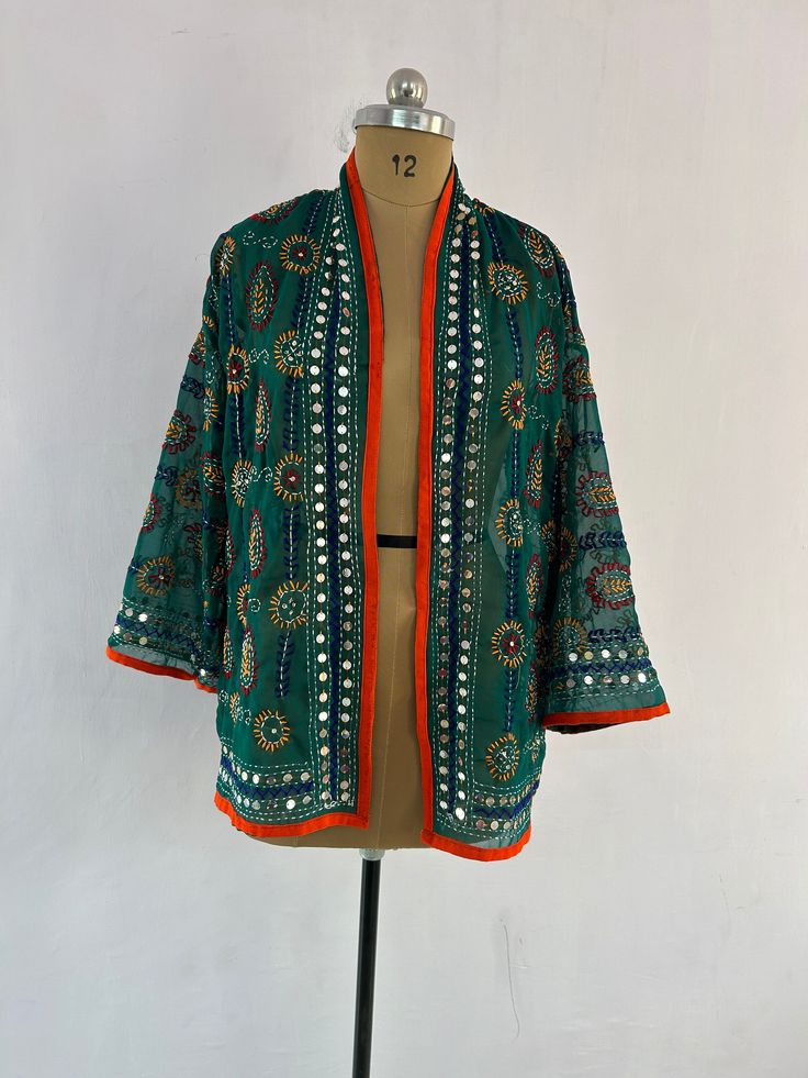 Indian Ethnic Jacket Phulkari Embroidered Vintage stylish designer jacket for women  This is made of cotton fabric with some unique stylish embroidery and printed. A unique combination of colorful embroidery in floral style and bird shape. This jacket is perfect for every traditional functions or parties this gives you a very attractive look. Shop this beautiful outfit for mother's day gift Size :One Size Chest : fits to 38 to 44 Inches chest Free Worldwide Shipping IMP NOTE: The colour of Picture shown above may slightly vary due to flash light, Screen and camera-resolution. Delivery Policies: . We dispatch your item within 1-3 days after order receive. . After dispatching item nothing in our hand like Exact delivery time. . You are responsible for the duties and taxes of your country. Re Traditional Long Sleeve Choli With Dupatta, Traditional Dupatta With Mirror Work For Spring, Traditional Green Choli For Spring, Spring Bollywood Dupatta With Mirror Work, Festive Chanderi Outerwear With Resham Embroidery, Bohemian Choli With Floral Embroidery For Spring, Festival Kimono With Long Sleeves, Festive Long Sleeve Choli With Chikankari Embroidery, Festive Choli With Chikankari Embroidery And Long Sleeves