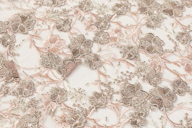 Taupe floral applique and soft pink floral embroidery with silver beads and clear sequins on a pink tulle with scalloped edges. Elegant Floral Embellished Lace Fabric, Elegant Silver Sequin Fabric With Floral Embroidery, Elegant Embroidered Fabric With Floral Applique For Party, Embellished Pink Sequin Fabric For Evening, Pink Embellished Sequin Fabric For Evening, Evening Pink Embellished Sequin Fabric, Elegant Pink Embroidered Fabric With Floral Design, Elegant Pink Sequin Fabric With Floral Embroidery, Elegant Spring Embroidered Fabric With Floral Applique