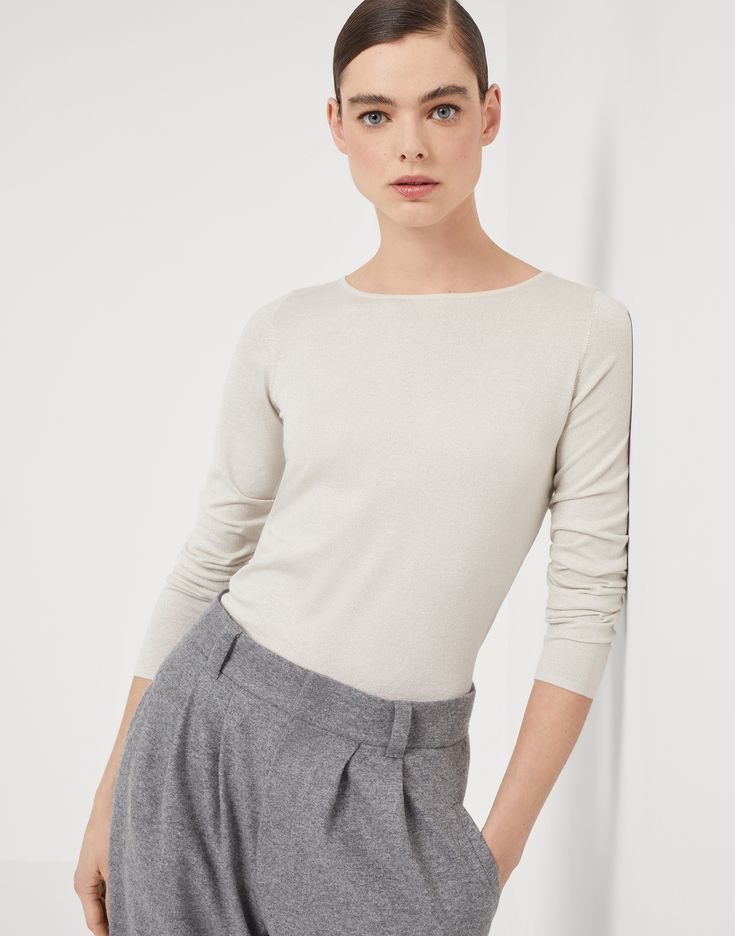 Cashmere and silk sparkling lightweight sweater Refined Brunello Cucinelli materials elevate the essential and feminine style of this new cashmere and silk sweater. The yarn’s lightweight and extremely soft texture pairs perfectly with the silhouette, characterized by fitted lines to the body in the bust and the shoulders. Elegant Fine Knit Cashmere Top, Elegant Fine Knit Crew Neck Sweater, Spring Cashmere Fine Knit Sweater, Elegant Cashmere Knit Top For Layering, Elegant Cream Cashmere Sweater, Elegant Long Sleeve Cashmere Top, Elegant Long Sleeve Knit Top, Chic Fine Knit Cashmere Sweater, Cream Fine Knit Cashmere Top