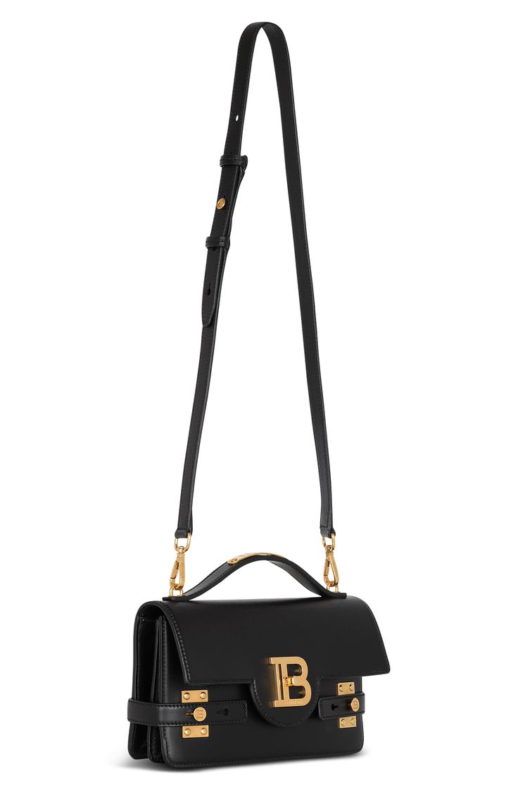 Gleaming hardware—a hallmark of Balmain designs—enhances the polished look and versatile functionality of this top-handle bag that converts to a crossbody. Turnlock flap closure Top carry handle; removable, adjustable crossbody strap Dual interior compartments; card slot Structured silhouette with flat base for stability Leather Made in Italy Designer Handbags Modern Handheld Satchel With Branded Hardware, Modern Crossbody Flap Bag With Logo Hardware, Modern Crossbody Box Bag With Branded Hardware, Evening Saddle Satchel Bag With Branded Hardware, Black Rectangular Flap Bag With Logo Hardware, Classic Rectangular Flap Bag With Logo Hardware, Evening Flap Shoulder Bag With Logo Hardware, Formal Rectangular Saddle Bag With Branded Hardware, Black Flap Bag With Logo Hardware For Everyday Use