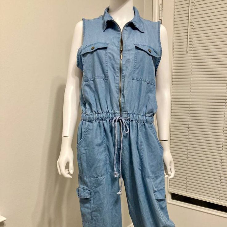 Nwt Love By Chesley Blue Denim Sleeveless Jumpsuit Sz 1x Blue Sleeveless Cotton Denim Jumpsuit, Sleeveless Light Wash Overalls With Pockets, Sleeveless Blue Cotton Denim Jumpsuit, Casual Sleeveless Medium Wash Denim Jumpsuit, Light Wash Sleeveless Cotton Denim Jumpsuit, Light Wash Sleeveless Casual Overalls, Sleeveless Denim Jumpsuits And Rompers With Pockets, Casual Sleeveless Denim Blue Jumpsuits And Rompers, Sleeveless Light Wash Denim Jumpsuit