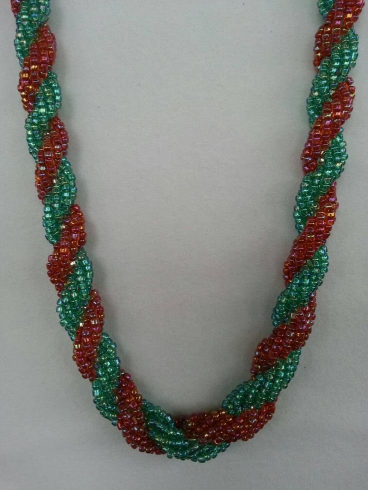 This turquoise and tangerine seed bead necklace is done in a double spiral pattern.  Each bead is individually hand woven.  Length is 18". Spiral Colorful Beads For Jewelry Making, Colorful Spiral Beads For Jewelry Making, Spiral Beaded Necklaces As Gifts, Spiral Beaded Necklace As Gift, Spiral Beaded Necklace For Gifts, Spiral Beaded Necklace For Gift, Handmade Spiral Beaded Necklace As Gift, Spiral Necklace, Spiral Pattern