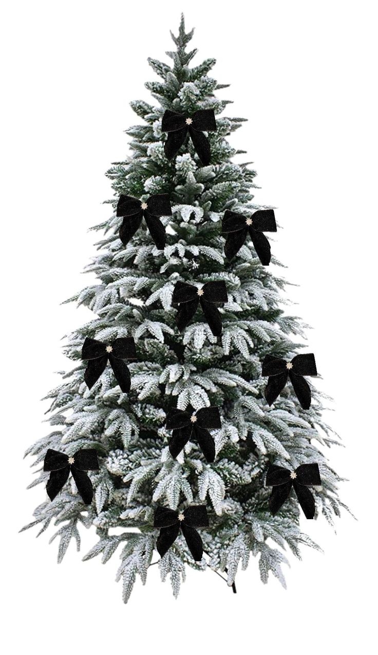 a white christmas tree with black bows and snow on the top is shown in front of a white background