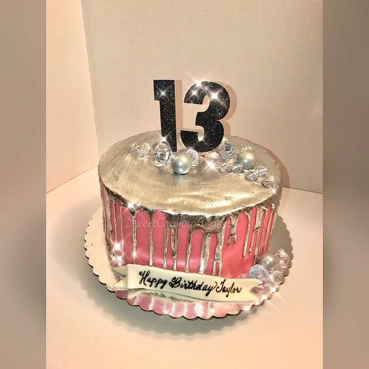 a birthday cake with the number thirteen on it