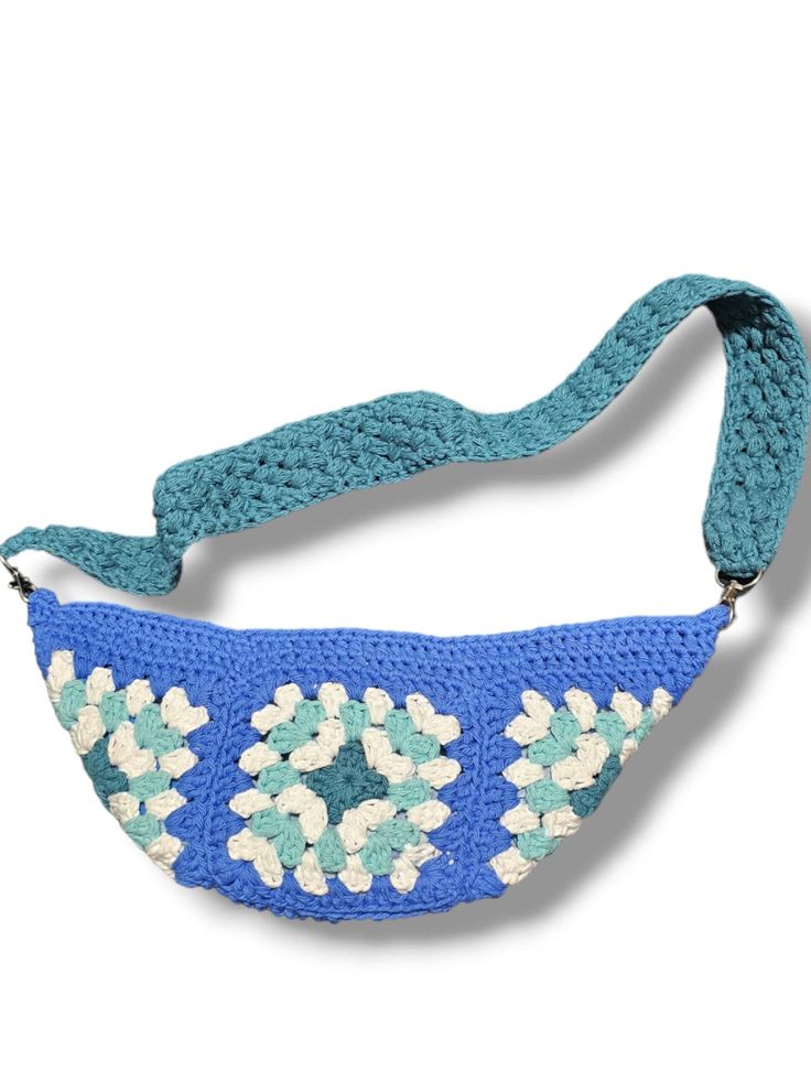 This crochet bag is handmade and is perfect for summer, going to a festival or just everyday! Crochet Shoulder Bag For Vacation, Casual Crochet Beach Bag, Trendy Blue Crochet Bags, Casual Hand Knitted Shoulder Bag, Hand Knitted Beach Bag For Summer, Hand Knitted Bags For Beach In Summer, Trendy Beach Crochet Bag With Granny Square Details, Summer Beach Hand Knitted Bag, Hand Knitted Summer Beach Bag