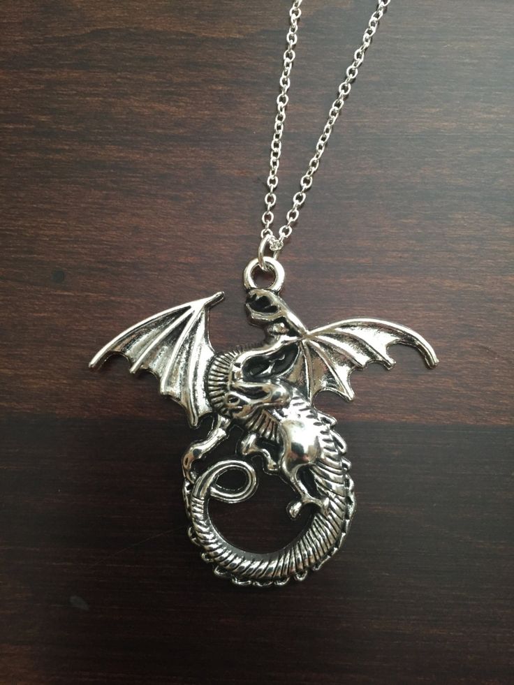 dragon, dragon necklace, dragon jewelry, silver dragon, silver dragon necklace, dragon pendant, silver necklace, necklace ★ Total Chain Length: 18 inches ★ Pendant Size: 43 mm x 46 mm This necklace is also available in gold: https://www.etsy.com/listing/251459116/dragon-dragon-necklace-dragon-jewelry?ref=shop_home_active_1 ★ Want to see more? Please click on: kmsupplies.etsy.com 26 Whale Jewelry, Whale Tail Necklace, Football Jewelry, Football Necklace, Necklace Dragon, Africa Earrings, Whale Necklace, Fox Jewelry, Foxes Necklace