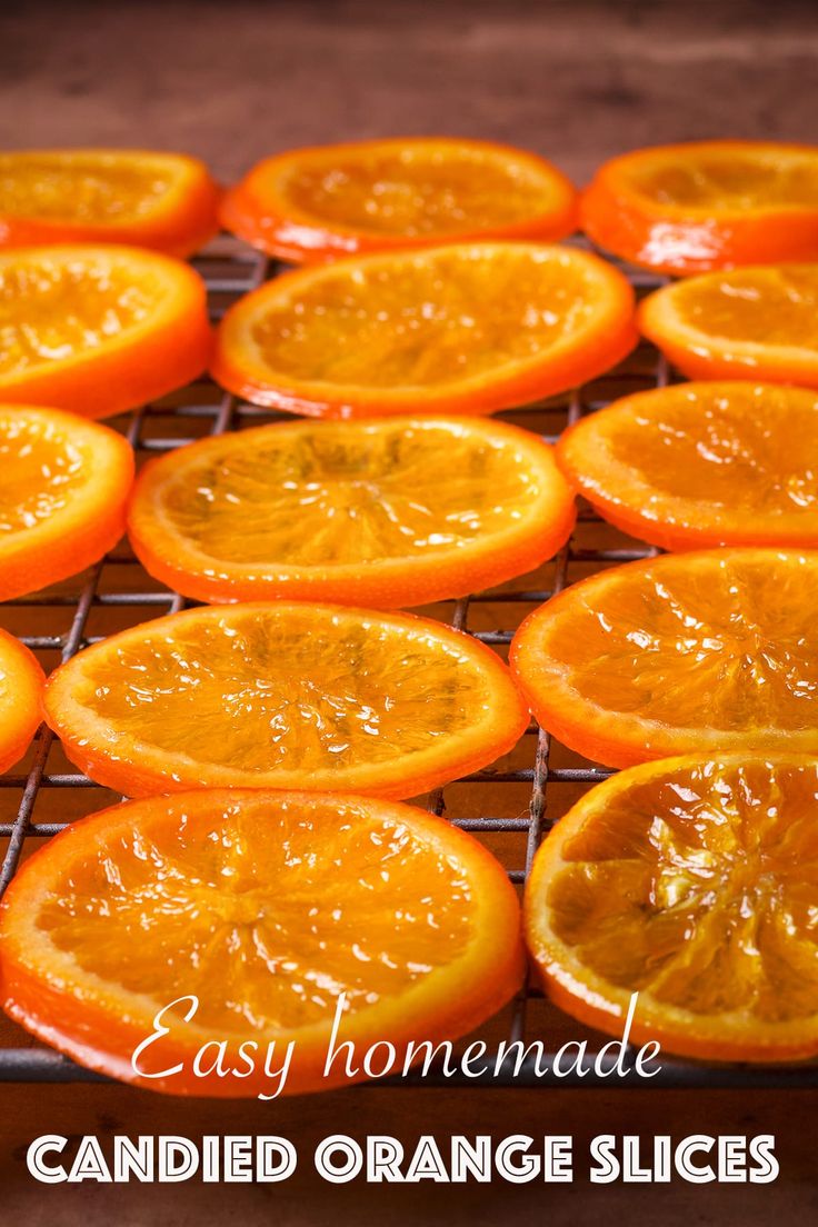 orange slices on a cooling rack with the words easy homemade candied orange slices