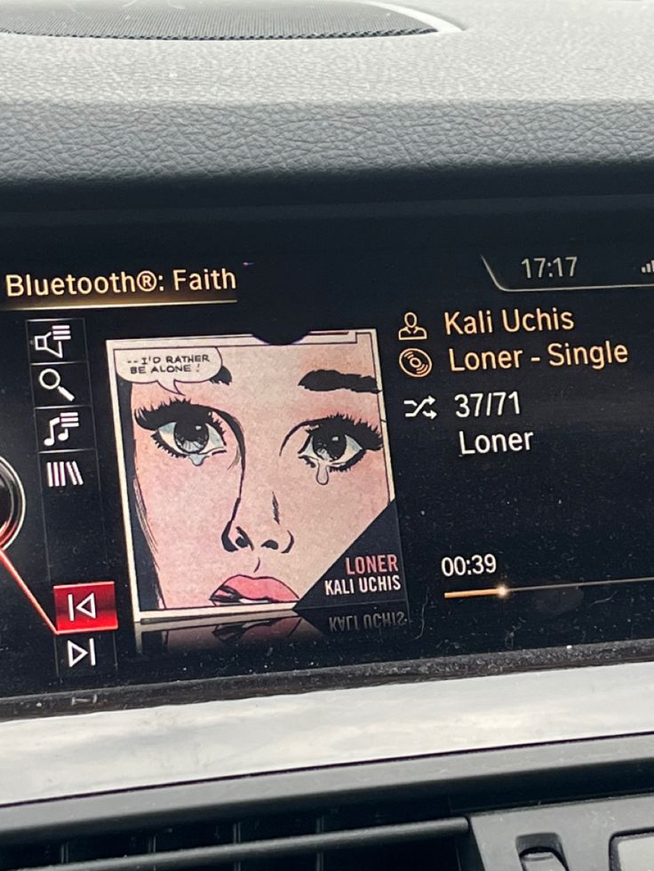 the dashboard of a car with an image of a woman's face on it