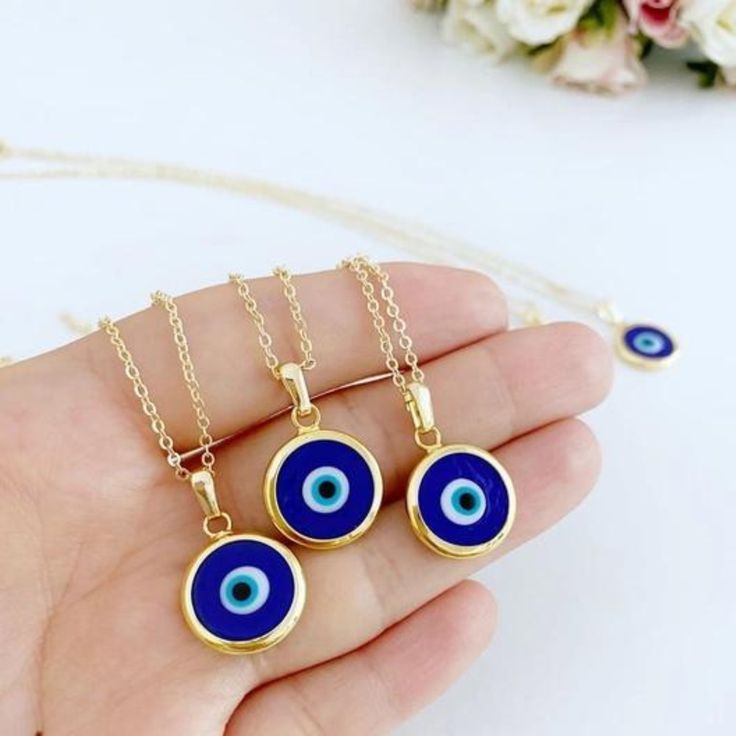 Ward off bad vibes in style with our Blue Turkish Evil Eye Necklace. Perfect for any occasion (except maybe a séance), this necklace features a stunning blue evil eye charm on a delicate chain. Keep the negativity away, all while looking fabulous. This necklace is combination of; - dark blue glass evil eye bead - stainless steel gold chain 15mm Charm Made in Turkey Blue Pendant Charm Necklaces For Spiritual Style, Blue Evil Eye Pendant Necklace, Blue Evil Eye Charm Necklace, Blue Pendant Charm Necklace With Adjustable Chain, Blue Evil Eye Jewelry As Gift, Blue Evil Eye Jewelry Gift, Spiritual Blue Charm Necklace With Adjustable Chain, Spiritual Blue Evil Eye Charm Necklace, Spiritual Blue Evil Eye Jewelry