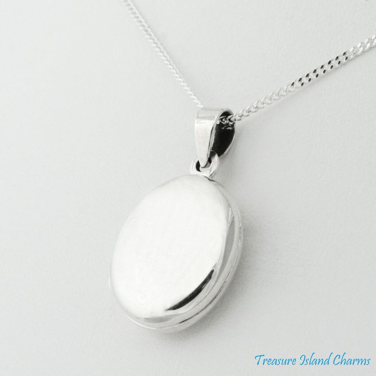 Small Two-Photo Locket .925 Solid Sterling Silver Pendant or Necklace The locket is high polished and can hold two small photos inside. The opening of the bail measures 4 x 3 mm. The locket is also offered with an optional 1mm sterling silver curb chain with a spring ring clasp, lengths: 16" or 18". Size and Description Pendant Dimensions 16 x 12 mm (5/8" x 1/2") Approximate Weight without Chain 2.5 grams Chain Length 16" or 18" Material .925 Sterling Silver Finish High Polished Condition NEW Hallmarked "925". Shipping within 1 business day of cleared payment. LOOKING FOR MORE TREASURES? We carry a large selection of the finest quality .925 sterling silver charms and pendants continuously updated with the latest trend. Visit our store TREASURE ISLAND CHARMS. Sterling Silver Charms, Photo Locket, Latest Trend, Treasure Island, Small Photos, Fine Jewellery Necklace, Curb Chain, Sterling Silver Charm, Sterling Silver Necklace