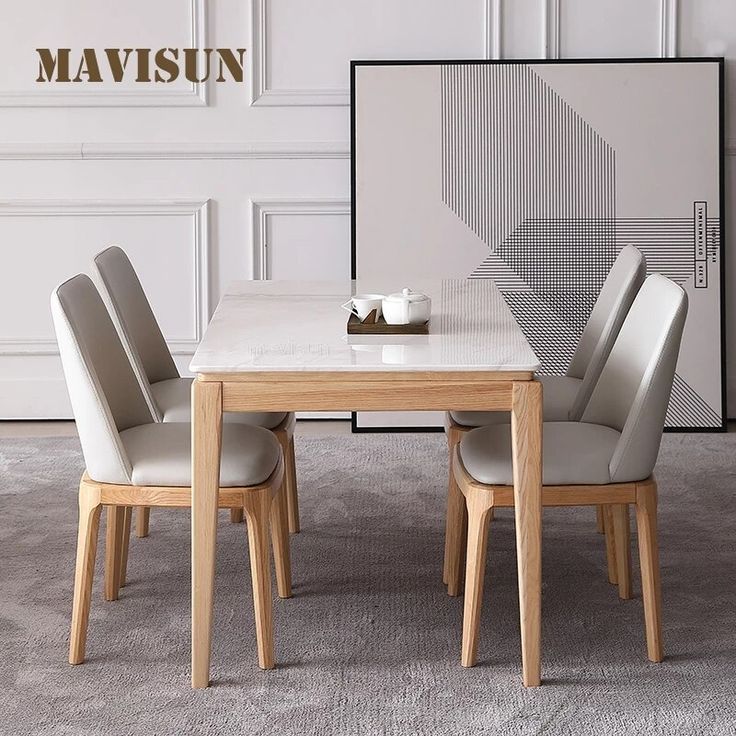 a dining table with four chairs around it and a white wall in the background that says mavisun