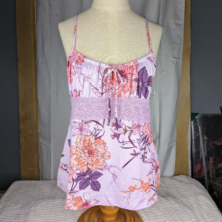 New With Tags Lovely, Silky Soft Cami With Adjustable Straps Beautiful Purples With Lace Overlay Band In Front Measurements Available Upon Request Offers Welcome! Summer Purple Cotton Sleepwear, Lavender Cotton Sleepwear For Summer, Purple Cami Sleepwear For Summer, Floral Print Lavender Top For Vacation, Lavender Floral Print Top For Vacation, Purple Floral Print Summer Tank Top, Summer Purple Floral Print Tank Top, Purple Camisole For Daywear, Fitted Purple Tank Top For Loungewear